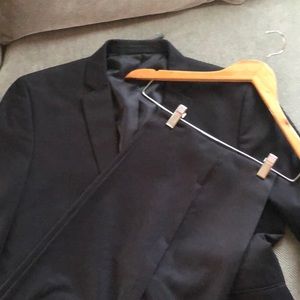 Black Kenneth Cole reaction suit.